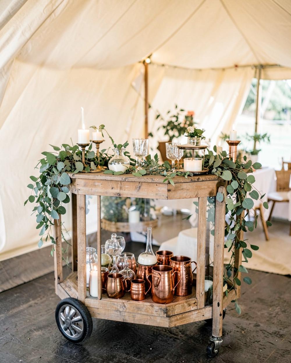 Styled bar cart with glassware and greenery